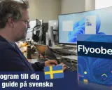 Man vid datorn, redo att uppdatera till Windows 11 med program och guide på svenska.