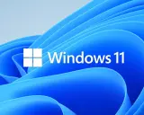 Utforskaren Windows 11 med dess ikon och logotyp mot en blå bakgrund med mjuka vågor.