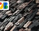 En samling av gamla typsnitt i trä och metall, redo att testa typsnitt. Google B-logotypen syns i övre vänstra hörnet.