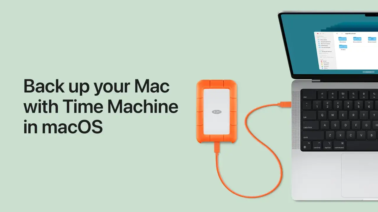 En orange extern hårddisk är ansluten till en MacBook för att säkerhetskopiera din Mac med Time Machine.